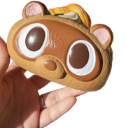 Capybara Cream Roll Squishy held in hand