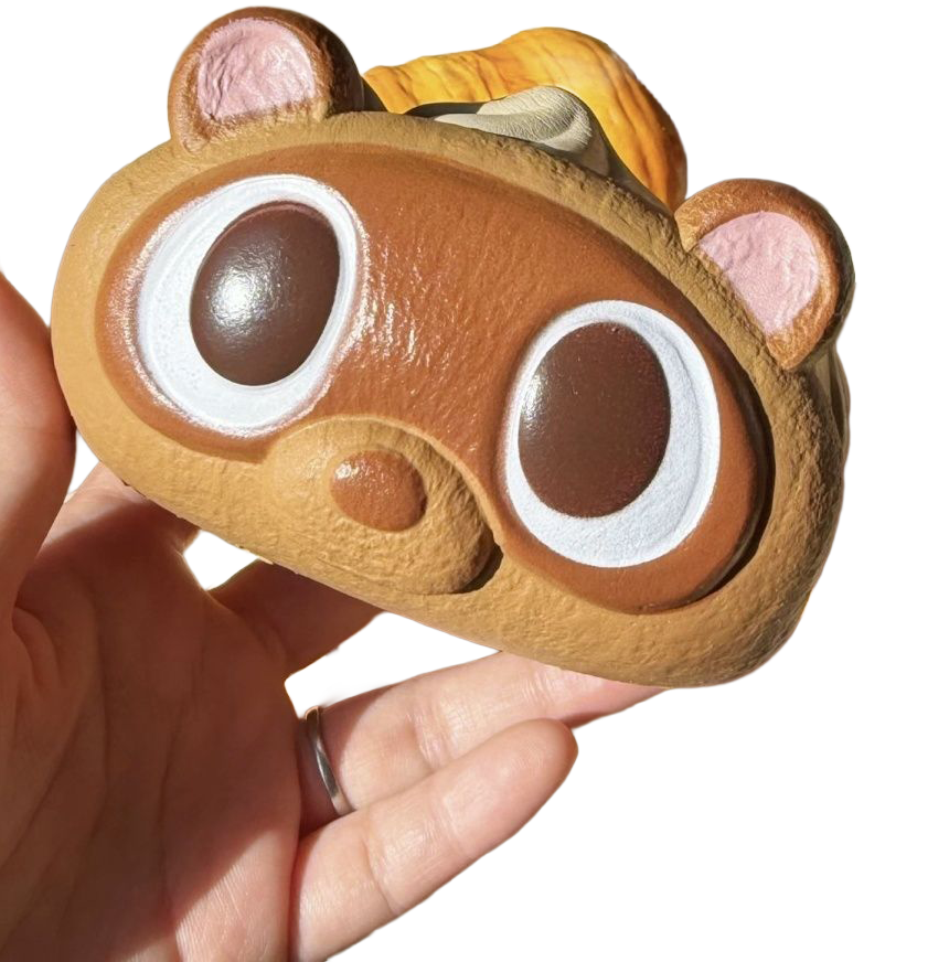 Capybara Cream Roll Squishy held in hand