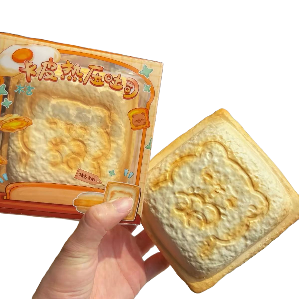 Capybara Panini Toast Squishy held in hand