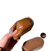 Chocolate Madeleine Squishy held in hand