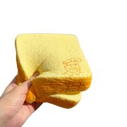 Grandpa Milk Toast Slice Squishy held in hand