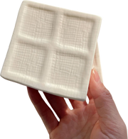Four-Cube Tofu Squishy — hand and product photograph