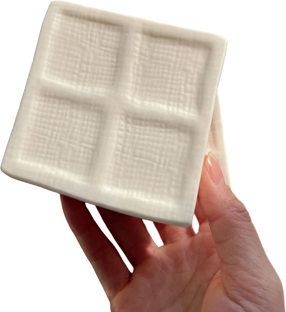 Four-Cube Tofu Squishy — hand and product photograph